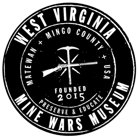 west virginia mine wars seal, which is black and white and shows a shotgun crossing a coal axe