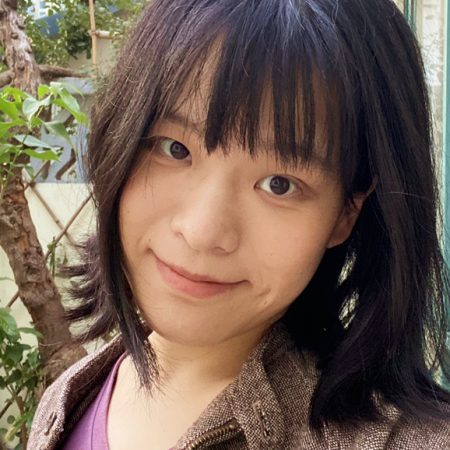 headshot of lei ting, who has short brown hair, bangs, and is wearing a brown collared jacket