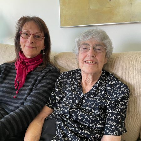 maggie holzberg and dottie rosenthal sitting on a couch