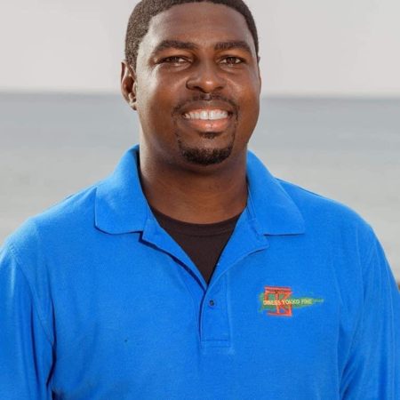 kendell henry wearing a blue-collared shirt